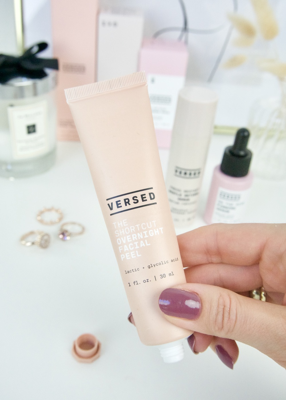 Versed Skincare The Shortcut Overnight Facial Peel in hand